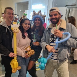 Balloon twisting for a party of adults in London