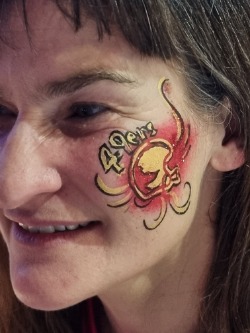 Adult face painting entertainment at London football themed event