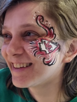Adult face painting entertainment at London football themed event