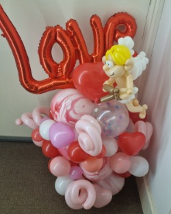 Valentines day balloon sculpture with Cupid and hearts