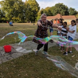 Giant bubbles at a party in Clissold Park London