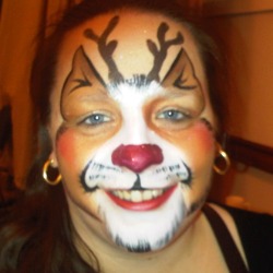 Christmas party face paint with reindeer design