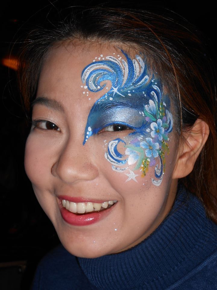 Face painting entertainment at a festival or community event