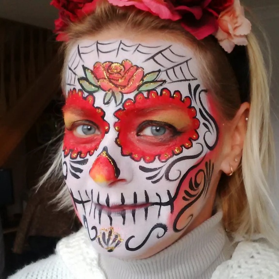 Halloween themed face painting sugar skull design