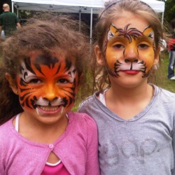 Lion and tiger facepaint at a school fete in London