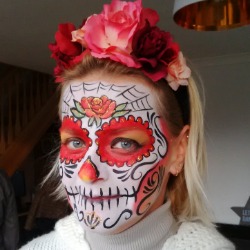 Professional sugar skull face painting for an adult Halloween event Professional sugar skull face painting for an adult Halloween event