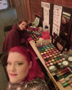Multiple face painters at a busy event in London