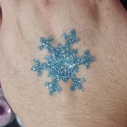 Blue snowflake glitter tattoo from a Christmas party in London