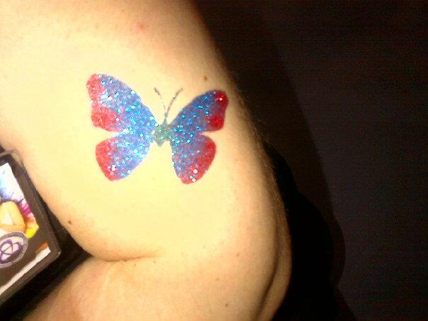 Close-up of a colourful glitter tattoo design Close-up of a colourful glitter tattoo design