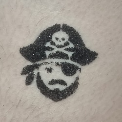 Pirate glitter tattoo from a themed party in London